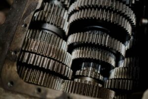Detailed shot of mechanical gears showcasing intricate steel parts and engineering precision. - Photo by cottonbro studio on Pexels