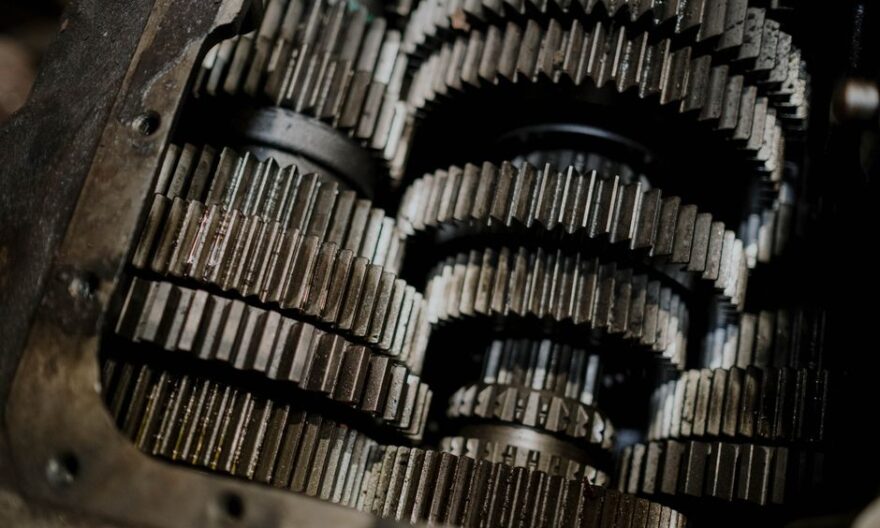 Detailed shot of mechanical gears showcasing intricate steel parts and engineering precision. - Photo by cottonbro studio on Pexels